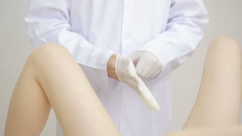 Doctor gynecologist performing an examination