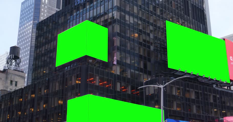 Green screen digital billboards on the side of a tall building in a large city.  	 Royalty-Free Stock Footage #22478623