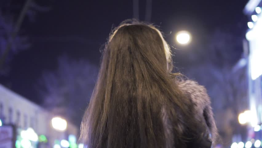 Young beautiful pretty woman posing at city street in the night against evening lights | Shutterstock HD Video #22478899