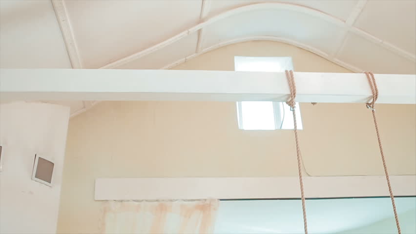 Room Hanging Swing. Around All Decorated With a Variety of Designer Items.