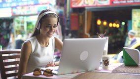 Happy young woman having video chat on laptop, , young girl is very emotional