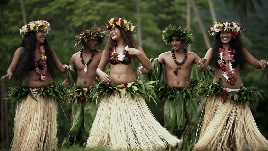 Young males with female group of Tahitian hula dancers performing outdoor b...