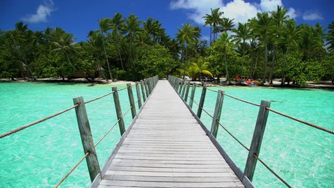 View of Bora Bora Island boardwalk in tropical Aquamarine lagoon a Tahitian hotel luxury resort in the South Pacific French Polynesia