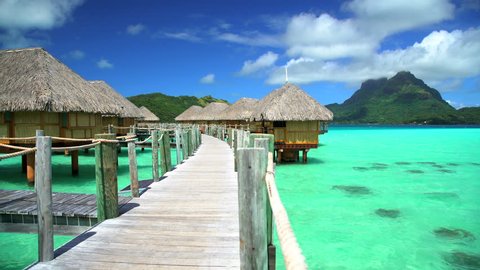 View of Bora Bora Island walkway in tropical Aquamarine lagoon a Tahitian hotel luxury resort in the South Pacific French Polynesia