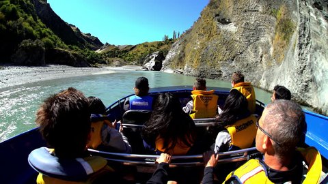 Outdoor tourist activity of exhilarating jet boat adventure through Shotover River canyons South Island New Zealand