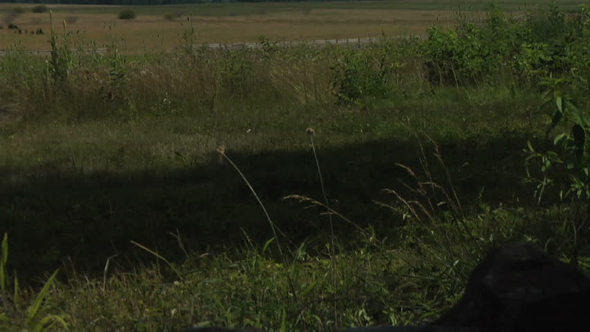 GETTYSBURG, PENNSYLVANIA - JULY 2013 - large-scale, epic Civil War anniversary. Gettysburg Battlefield monuments, memorials, snake rail fences & fields.  National Military Park and historical landmark