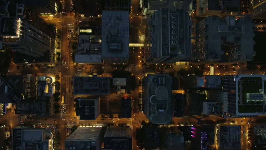Aerial vertical overhead rooftop illuminated view of Chicago city streets road traffic and Downtown Skyscraper buildings Business and Financial District USA Illinois RED DRAGON