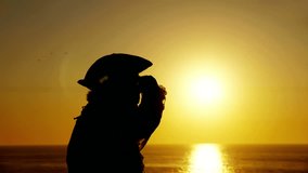 Explorer With Spyglass Silhouette (HD). Explorer or sailor silhouette against sunset with a spyglass looking around. 