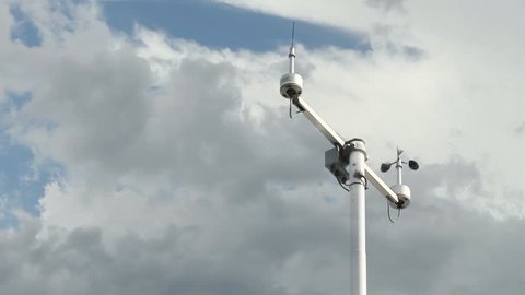 Anemometer over cloudy sky