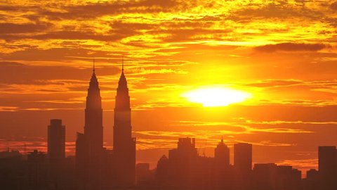 Time lapse of sun setting over skyline of Kuala Lumpur, Malaysia Stock Video