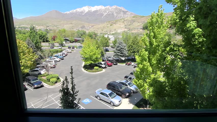 Beautiful mountain scenery and parking lot outside of office window