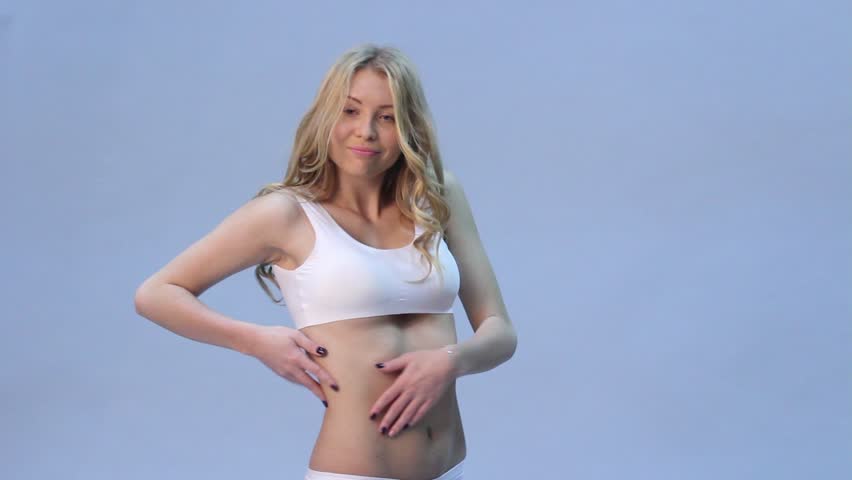 Surprising woman portrait with breast in bra with meter tape. Diet and fitness concept healthy lifestyle.