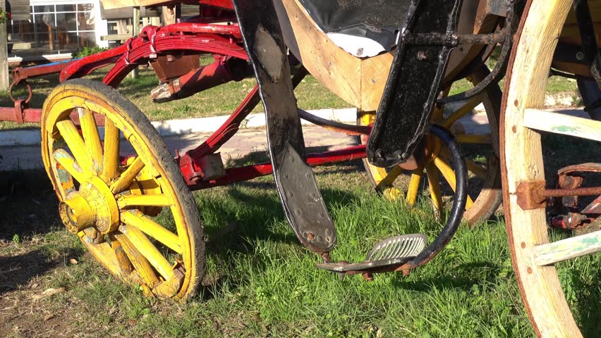 4K Zoom out and trekking shot of an old original carriage 

