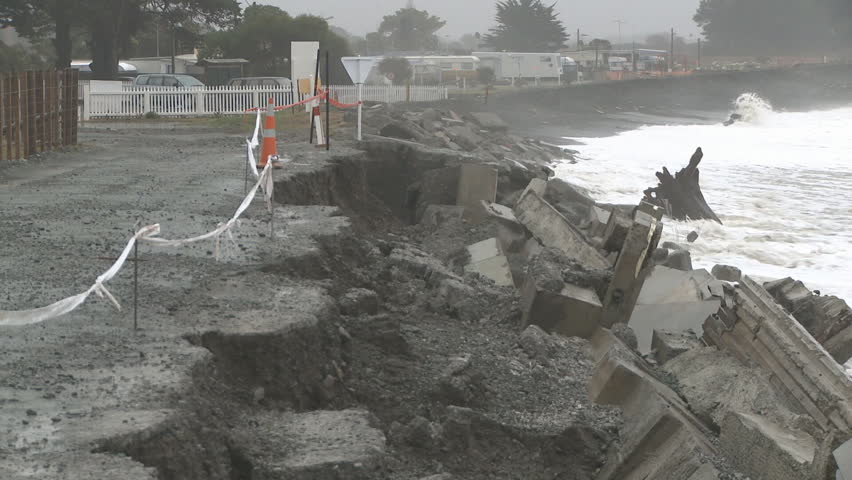 a coastal road destroyed by storm driven waves