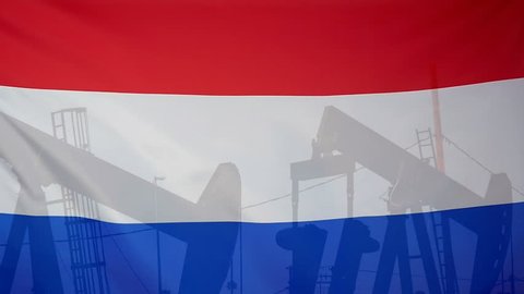 Concept oil production in Netherlands oil pumps and dutch flag in slow motion movement