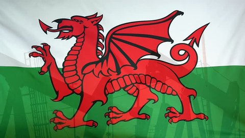 Concept oil production in Wales oil pumps and welsh flag in slow motion movement