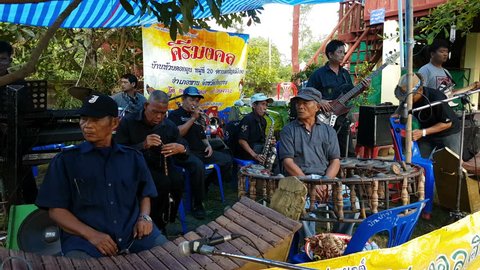 CHIANG RAI, THAILAND - NOVEMBER 19 : 4K Unidentified asian band playing traditional thai musical instruments concert show in funeral on November 19, 2016 in Chiang rai, Thailand