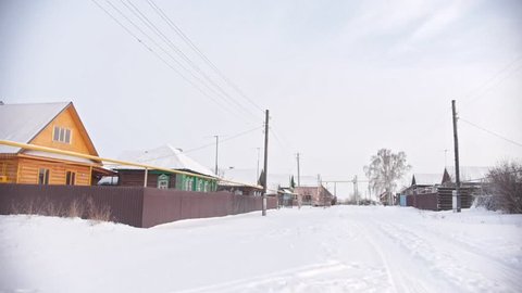 Russian typical countryside - winter village in center of Volga, snow cold day
