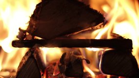 The dying embers in the fireplace, A looping clip of a fireplace with medium size flames.Full HD video, resolution 1920x1080. FHD.