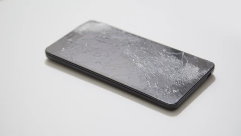 Broken LCD screen of the smartphone, faulty smartphone