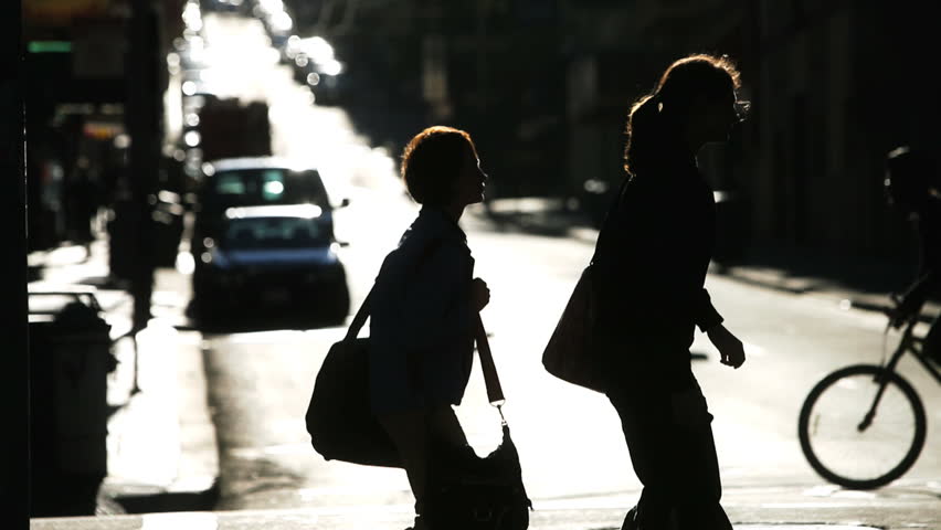 Silhouetted pedestrian and street traffic in San Francisco
