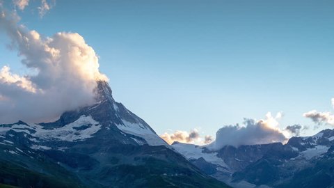evening sunset time lapse of the amazing matterhorn mountain in the Swiss Alps.