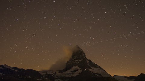 nighttime star time lapse of the amazing matterhorn mountain in the Swiss Alps.