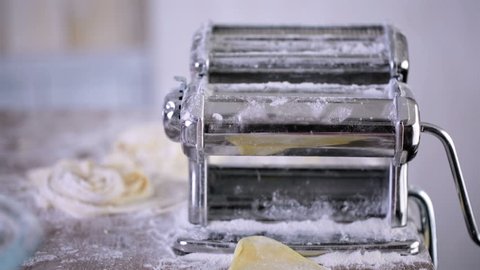 Preparing home made pasta with pasta maker.