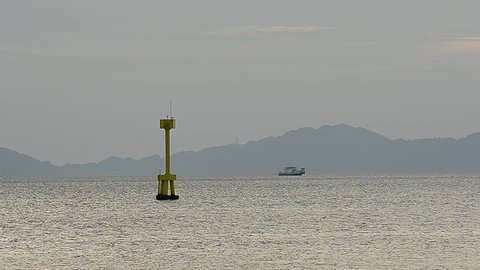 Floating Yellow Navigation Buoy on sea at Malaysia