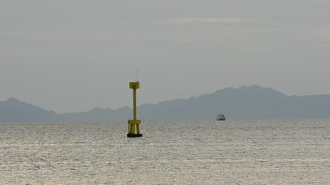 Floating Yellow Navigation Buoy on sea at Malaysia