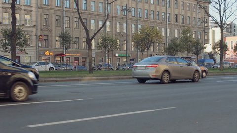 ST. PETERSBURG, RUSSIA - OCTOBER 19,2016: Tram passes busy street