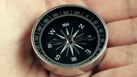 Compass Magnetic North Lost (HD). Compass specially rigged to show unstable north motion by using magnets. Could be used for the magnetic north flip theme or exploration without direction.