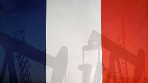 Concept oil production in France oil pumps and french flag in slow motion movement