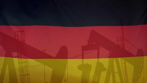 Concept oil production import/export in Germany oil pumps and german flag in slow motion movement