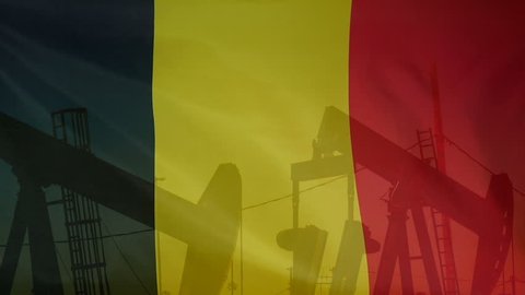 Concept oil production in Belgium oil pumps and belgian flag in slow motion movement
