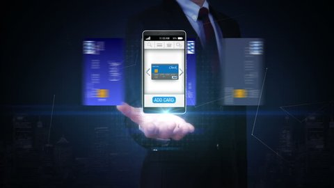 Businessman open palm, credit card into smartphone, mobile, concept of mobile payment, mobile credit card.