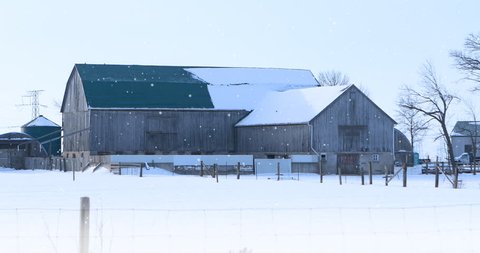 4K UltraHD Old barn and gently falling snow