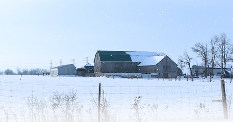 4K UltraHD Old barn with gently falling snow