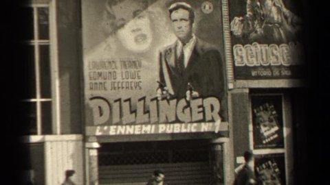 PARIS FRANCE 1947: people walking past billboard signs