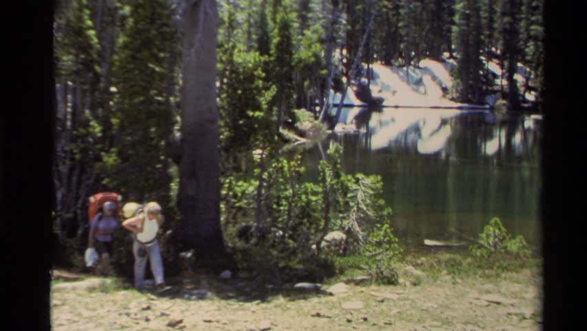 LAKE TAHOE CALIFORNIA 1978: hikers making their way through a dense forest