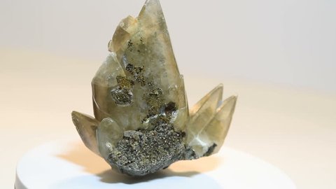 Dogs tooth calcite crystals with chalcopyrite and galena specimen rotating.