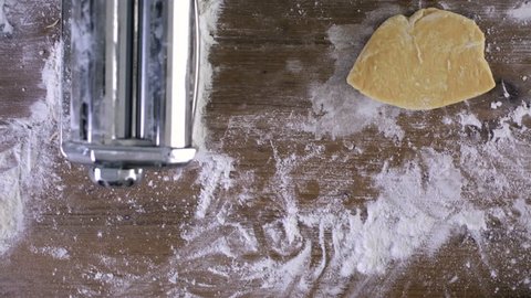 Time-lapse. Preparing home made pasta with pasta maker.
