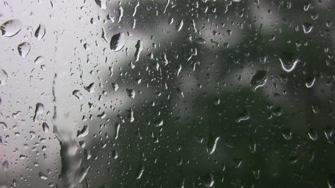 Rain running down window.