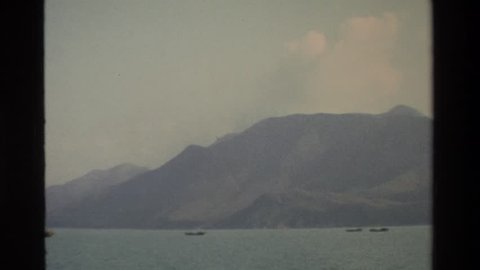 HONG KONG 1984: view of a very large body of water with buildings surrounding it