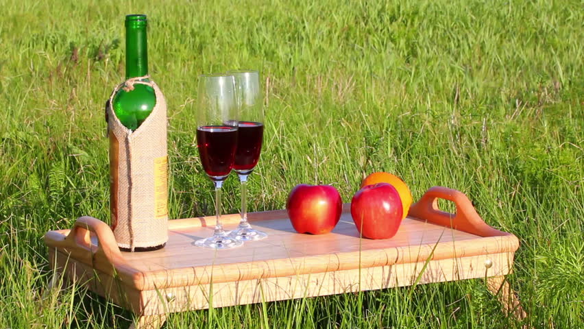 picnic - tabel with wine and fruits