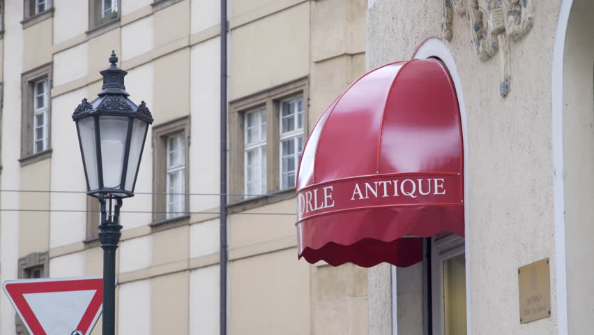 Antique shop sign, old antique street light, Prague, Czech Republic