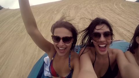 Friends taking a selfie and having Fun in the Buggy, Natal, Brazil