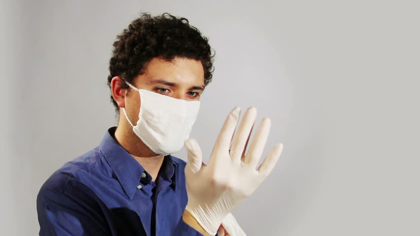 young doctor wearing medical gloves
