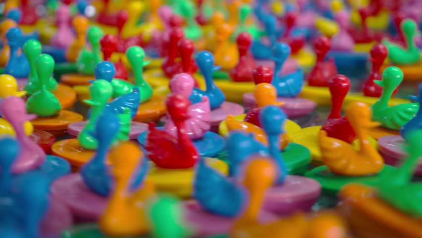 Colorful Floating Rubber ducks toy flowing in water,