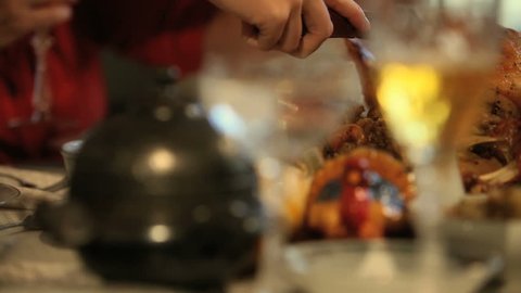 Family member carving the Thanksgiving turkey Adlı Stok Video